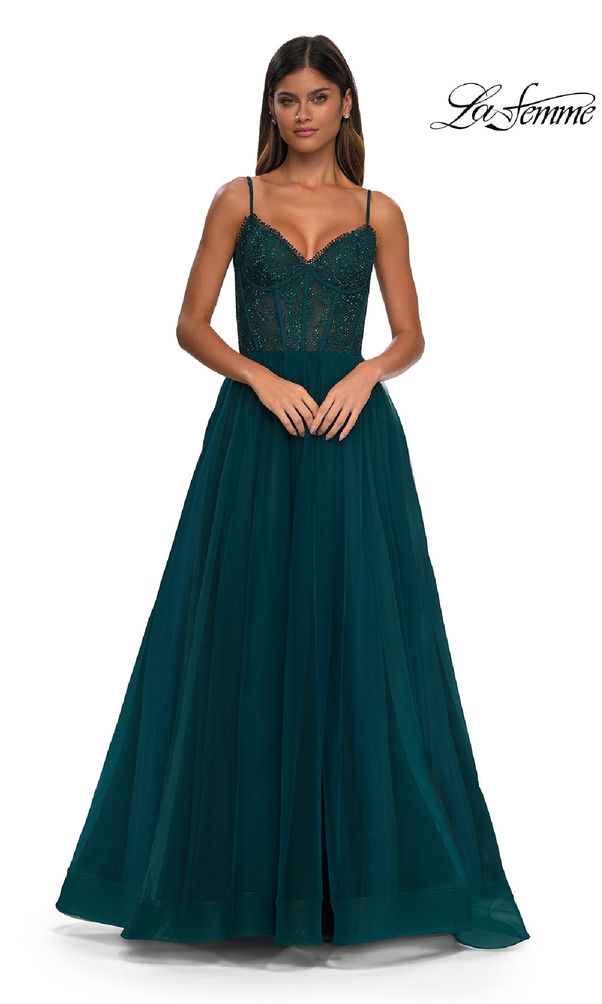 A woman models the Beaded-Bodice Long Prom Ball Gown (La Femme 32594), a dark teal, floor-length dress with thin straps, against a plain white background. The La Femme logo is visible in the top right corner.